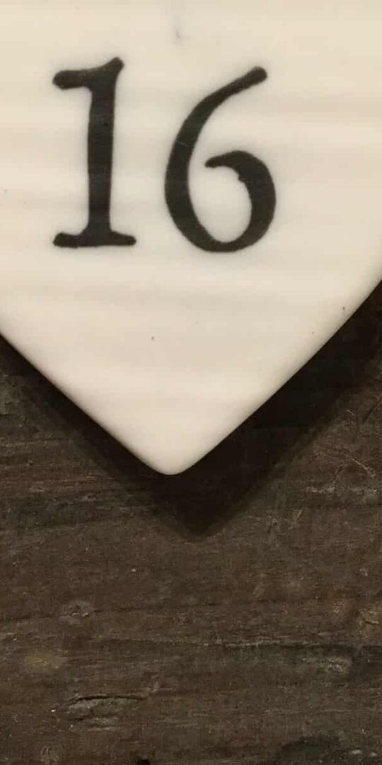 East Of India: Small White Porcelain Hanging Heart with Birthday Number in Black Writing: 16