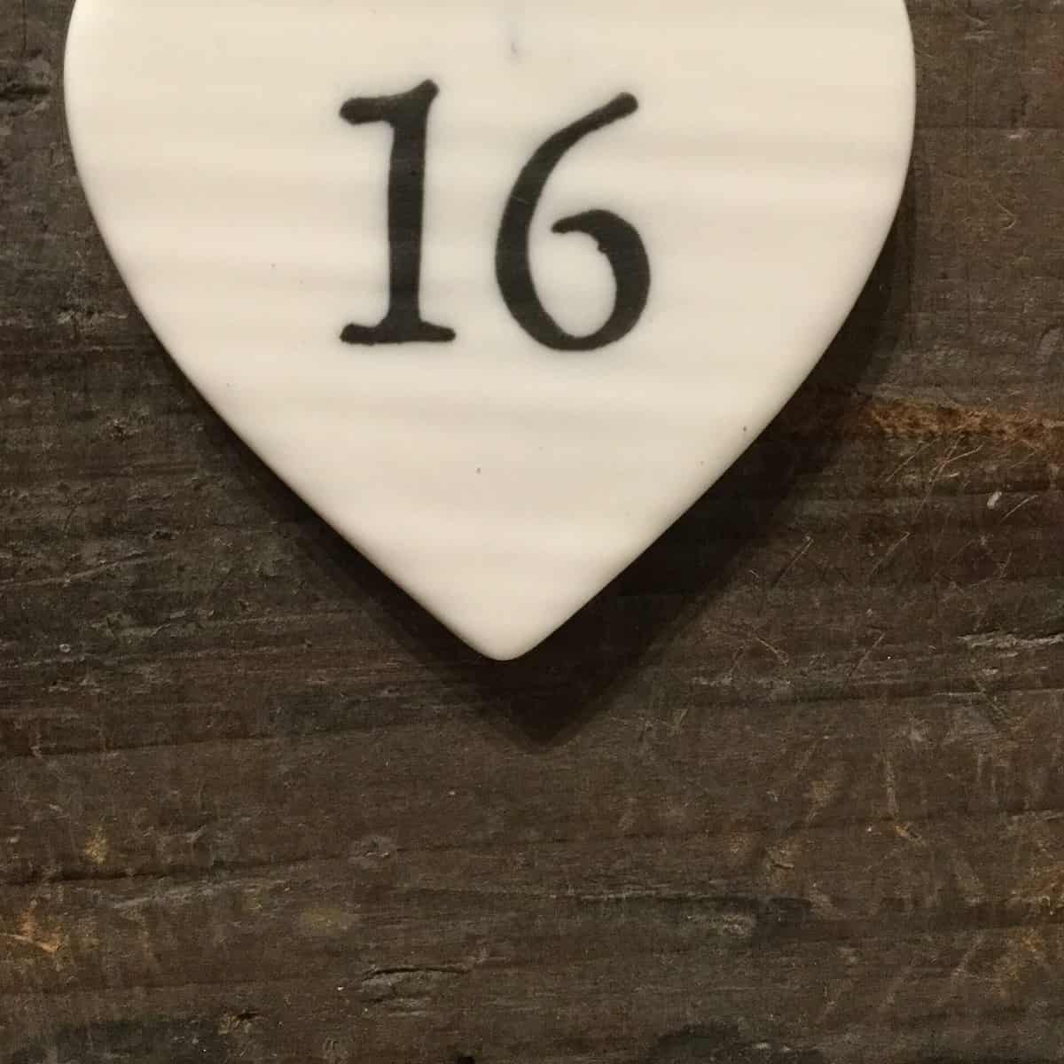East Of India: Small White Porcelain Hanging Heart with Birthday Number in Black Writing: 16