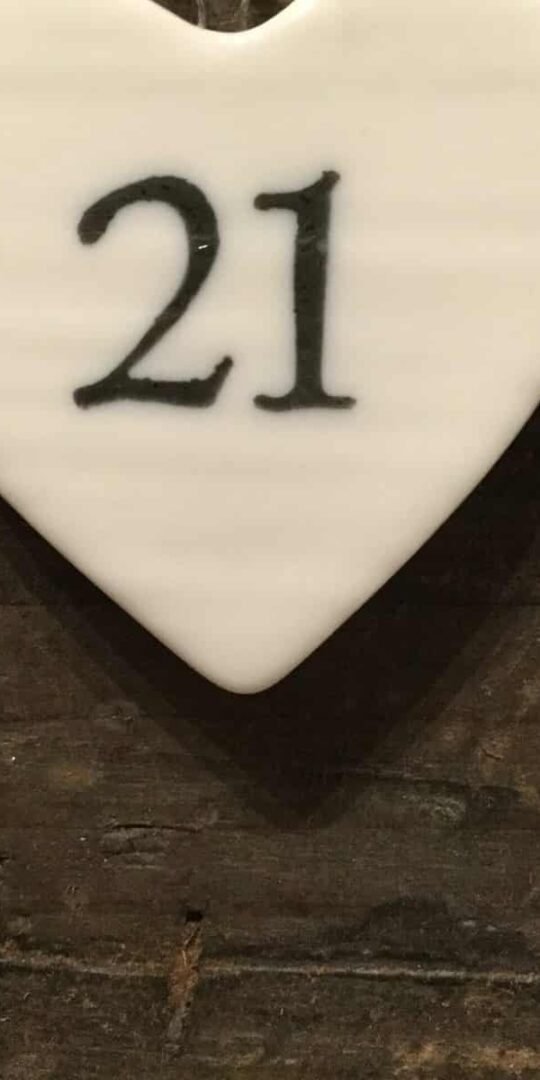 East Of India: Small White Porcelain Hanging Heart with Birthday Number in Black Writing: 21