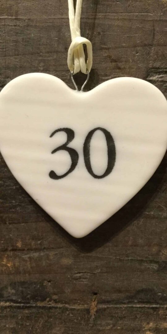 East Of India: Small White Porcelain Hanging Heart with Birthday Number in Black Writing: 30