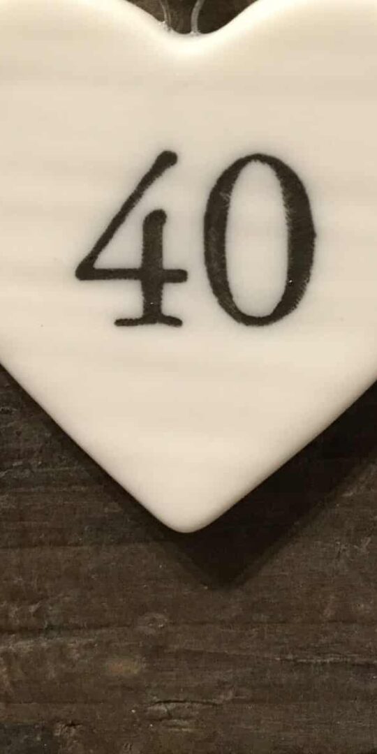East Of India: Small White Porcelain Hanging Heart with Birthday Number in Black Writing: 40