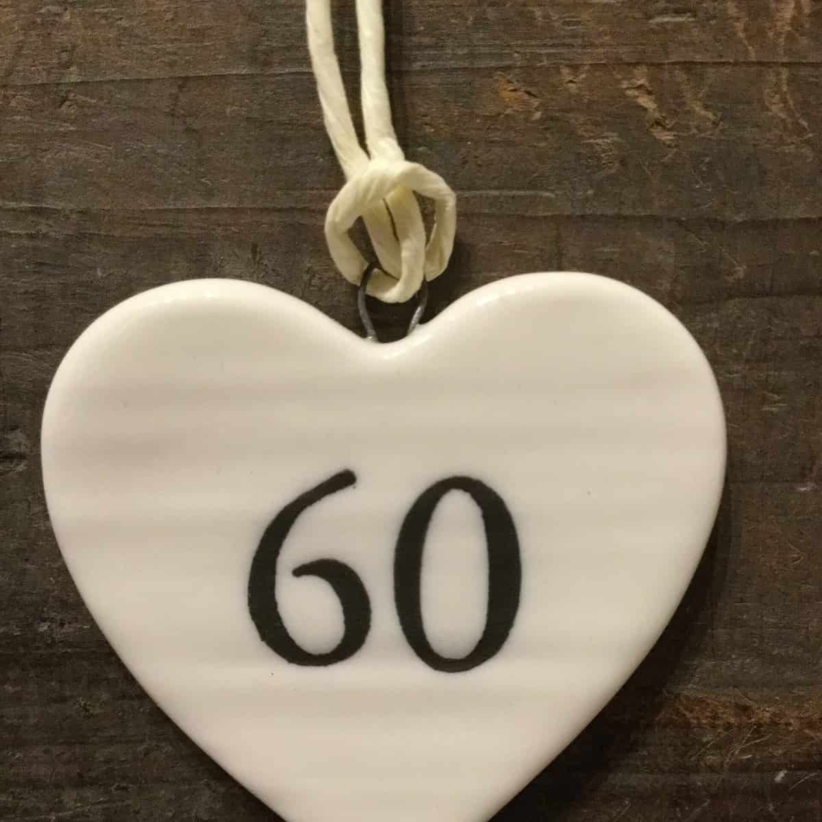 East Of India: Small White Porcelain Hanging Heart with Birthday Number in Black Writing: 60
