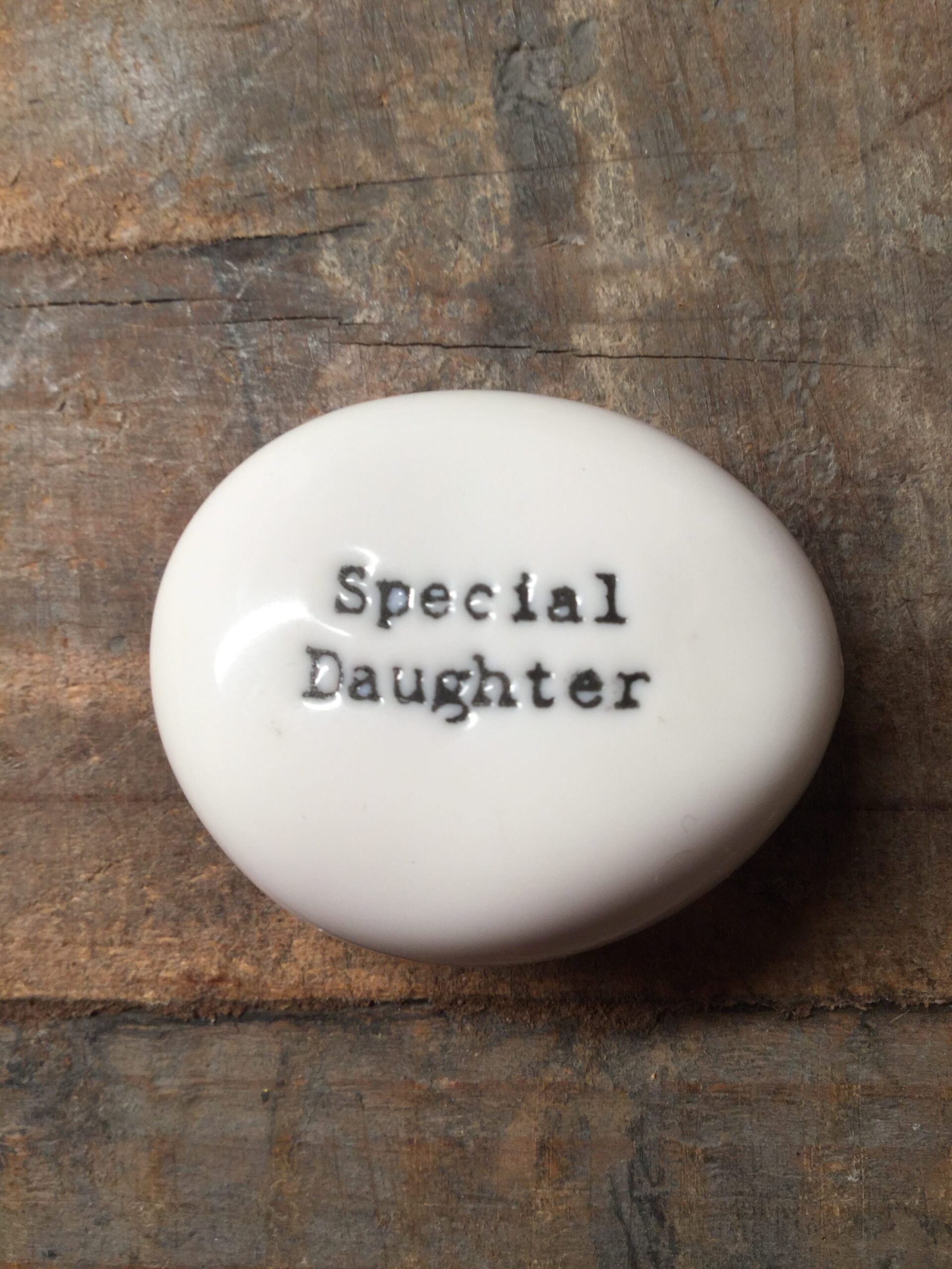 East Of India Small White Porcelain Pebble with Black Type Engraved. Saying: Special Daughter