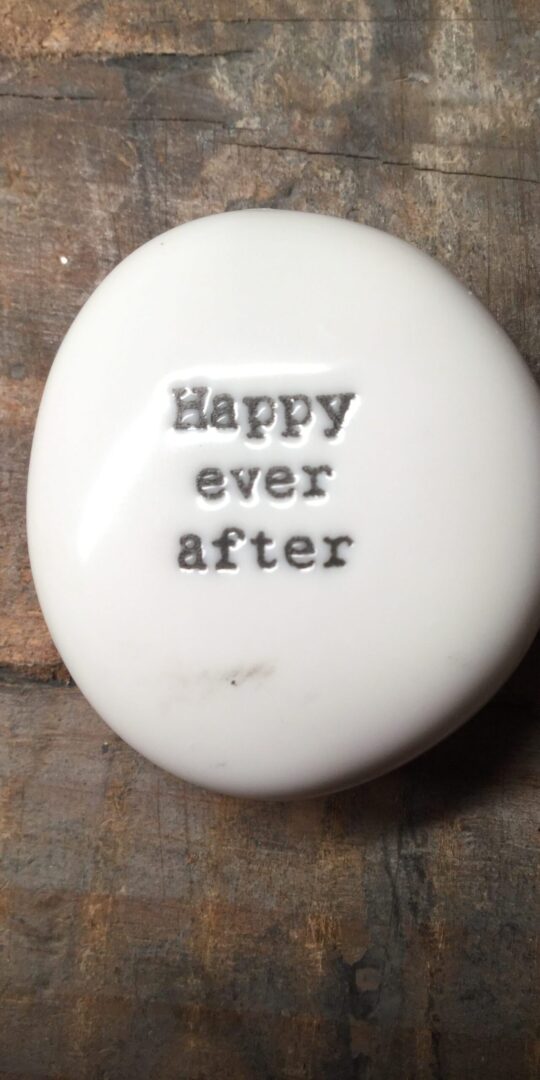 East Of India Small White Porcelain Pebble with Black Type Engraved. Saying: Happy Ever After