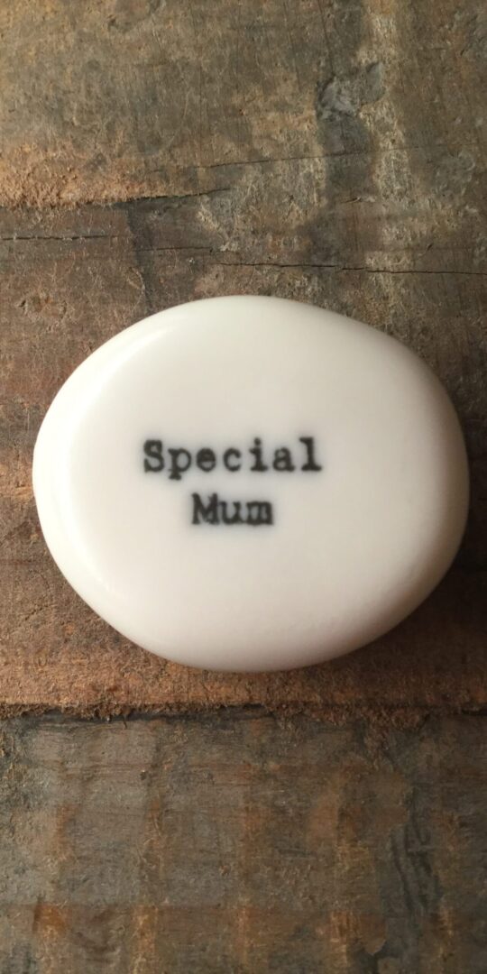 East Of India Small White Porcelain Pebble with Black Type Engraved. Saying: Special Mum