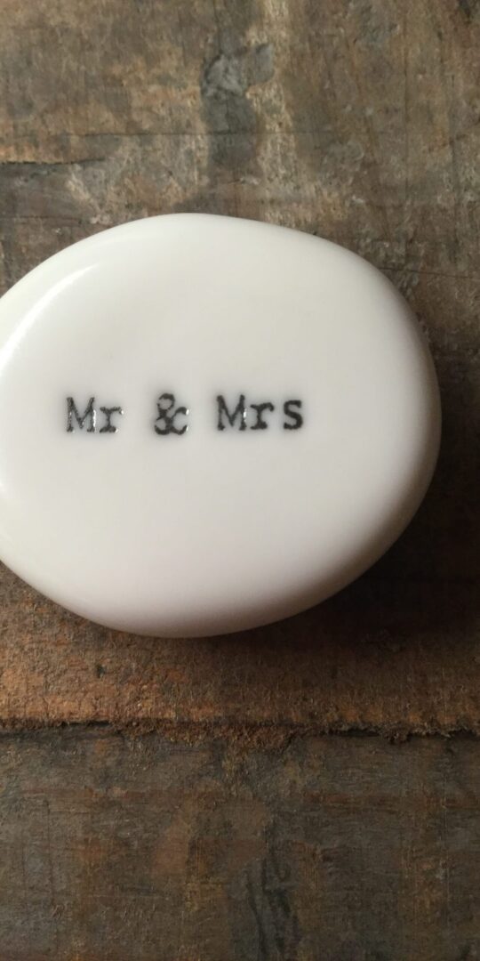 East Of India Small White Porcelain Pebble with Black Type Engraved. Saying: Mr & Mrs