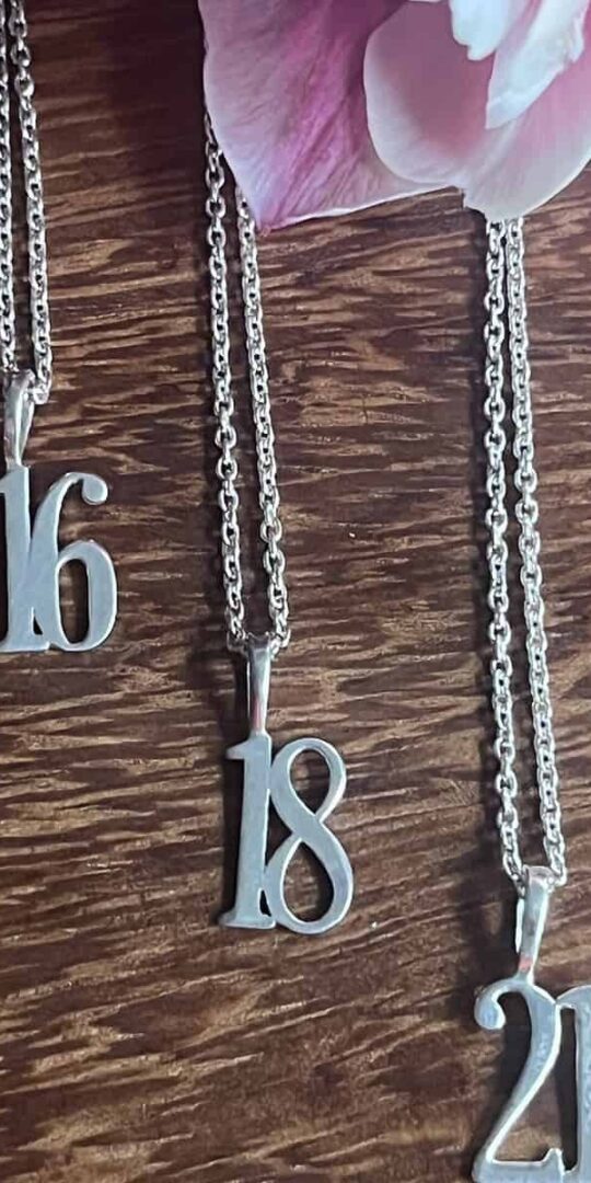 Delicate Silver numbered charms on a 14" chain