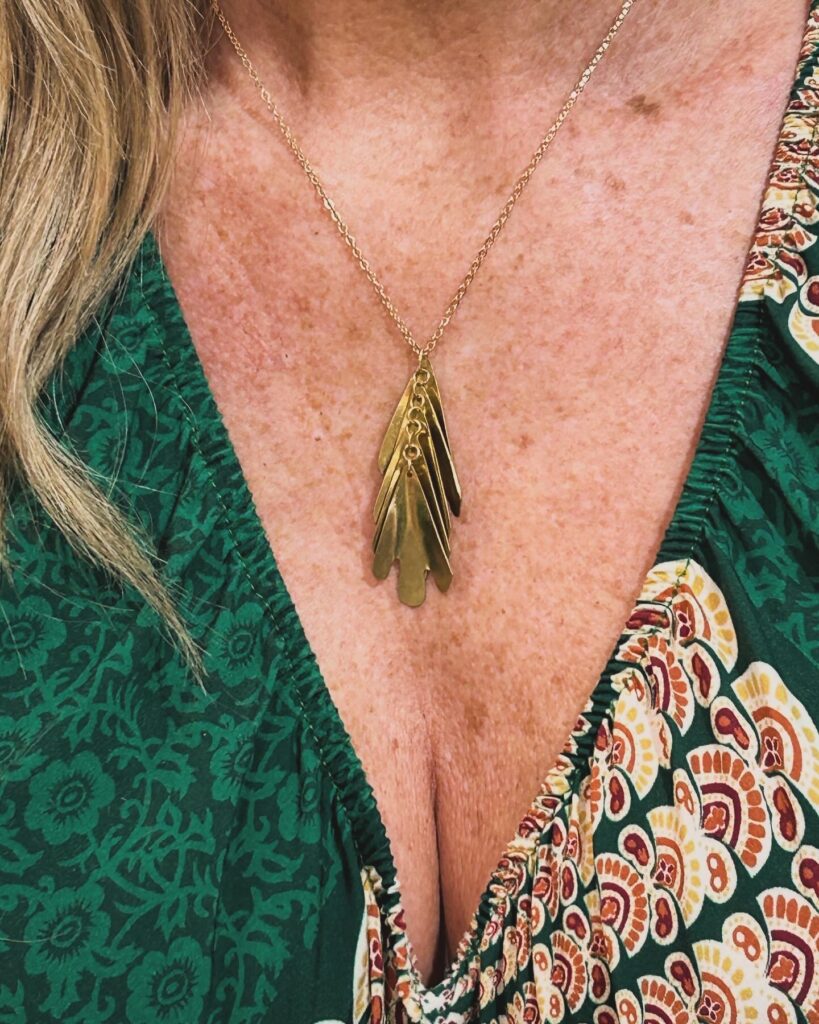 Original cascade shaped brass pendant with gold plated brass chain.