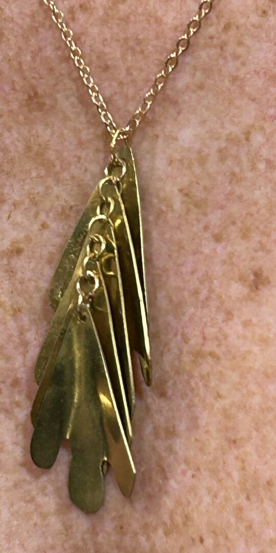 Original cascade shaped brass pendant with gold plated brass chain.