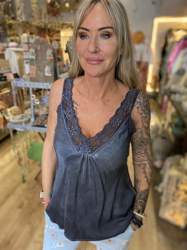 Lacey vest top. V-Neck and gather at the front. Navy