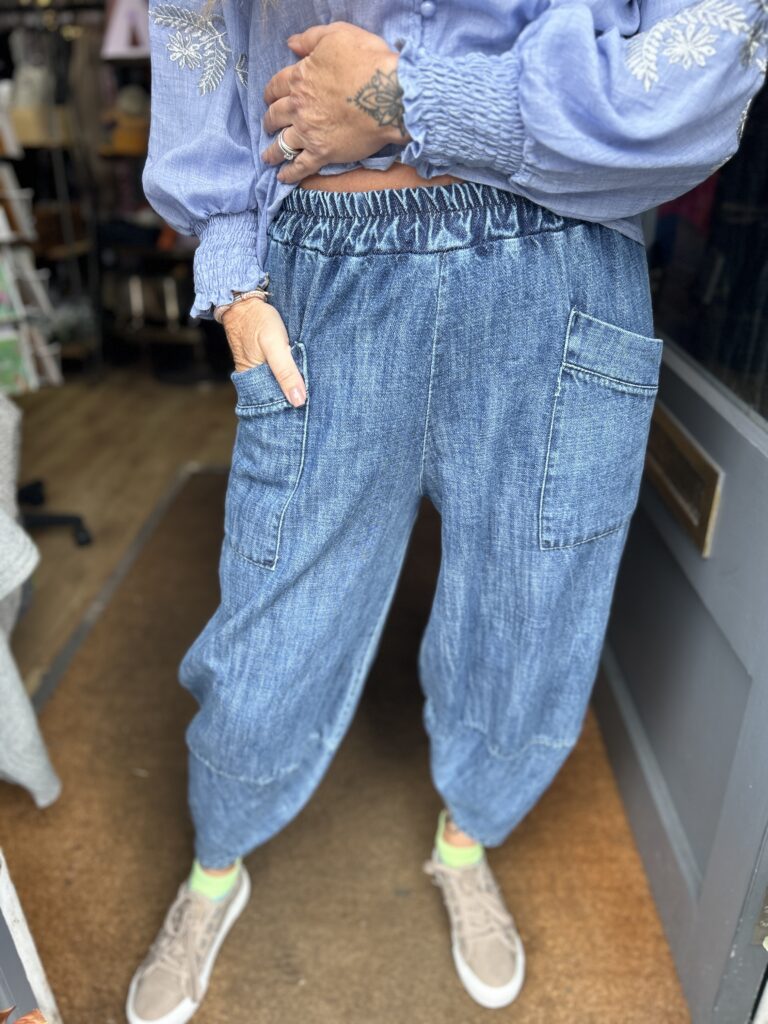 Ravello denim trousers. Elasticated waist. Patch pockets.