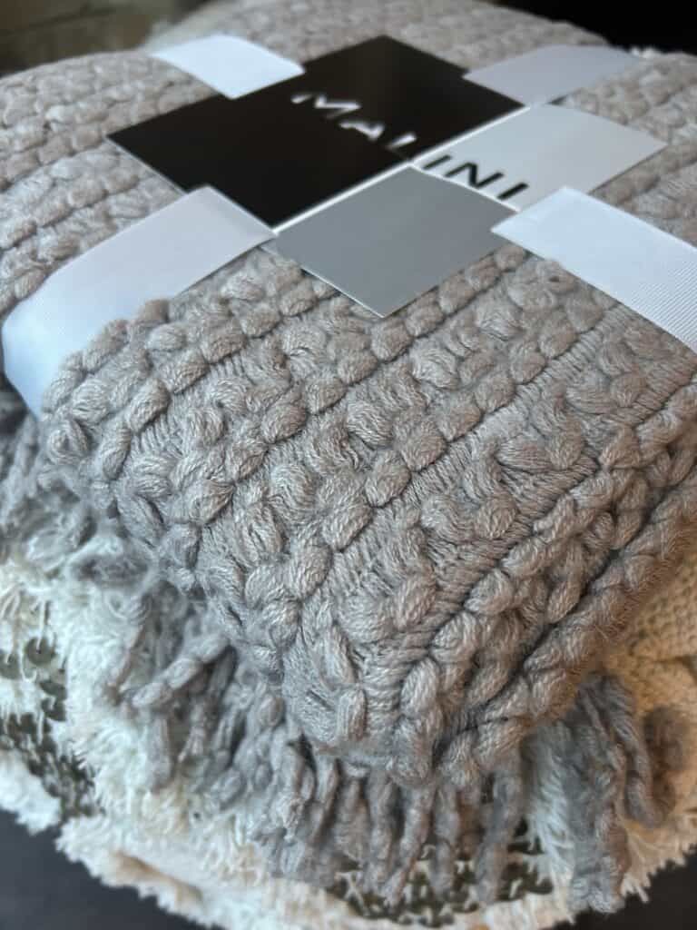 Brixton Throw in Taupe. Super soft, textured and fringed