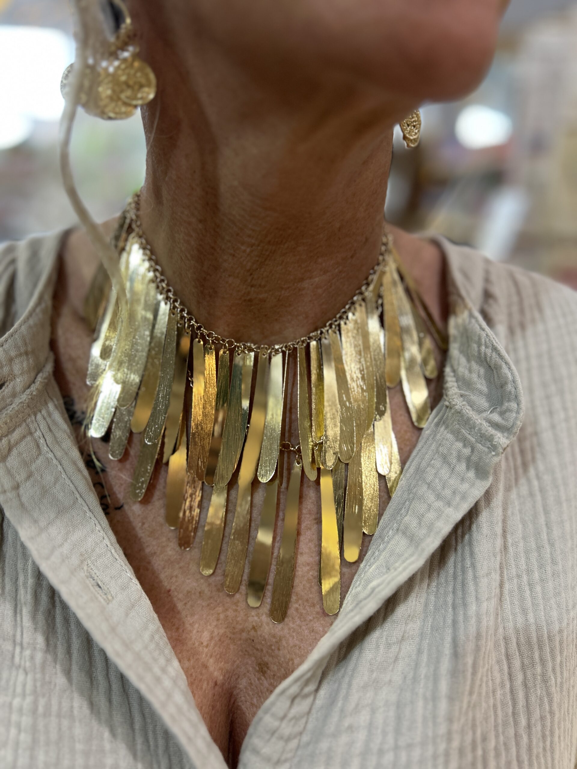 Golder Waterfall Necklace. Two tiers of gold metal fringe.