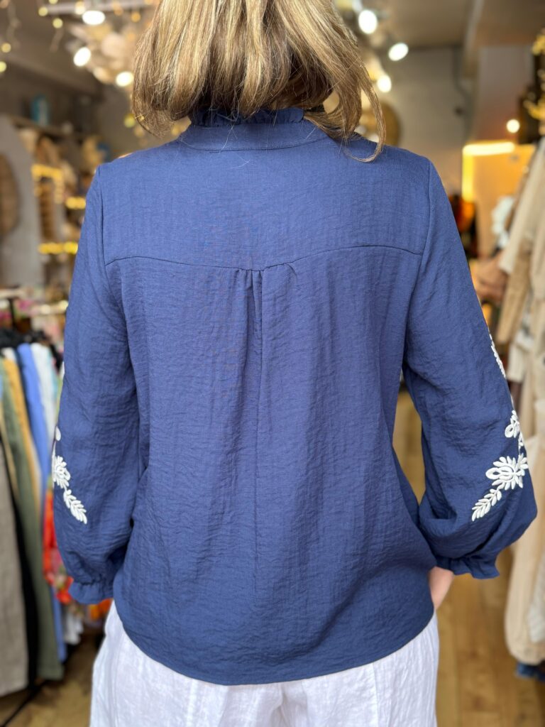 Dolly blouse. Navy, white embroidery on shoulder, front and sleeve.