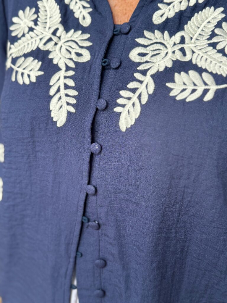 Dolly blouse. Navy blue,. White embroidery.