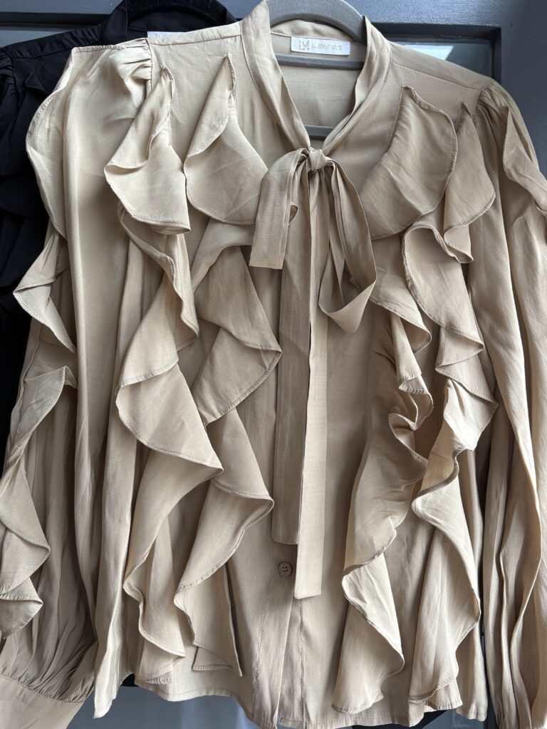 Lando Blouse. Frills and tie on front. Puff long sleeves. Latte