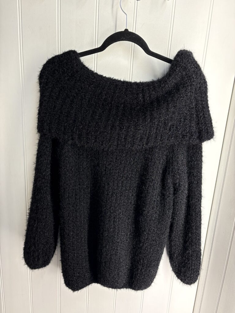 Angelo Off Shoulder jumper. Black