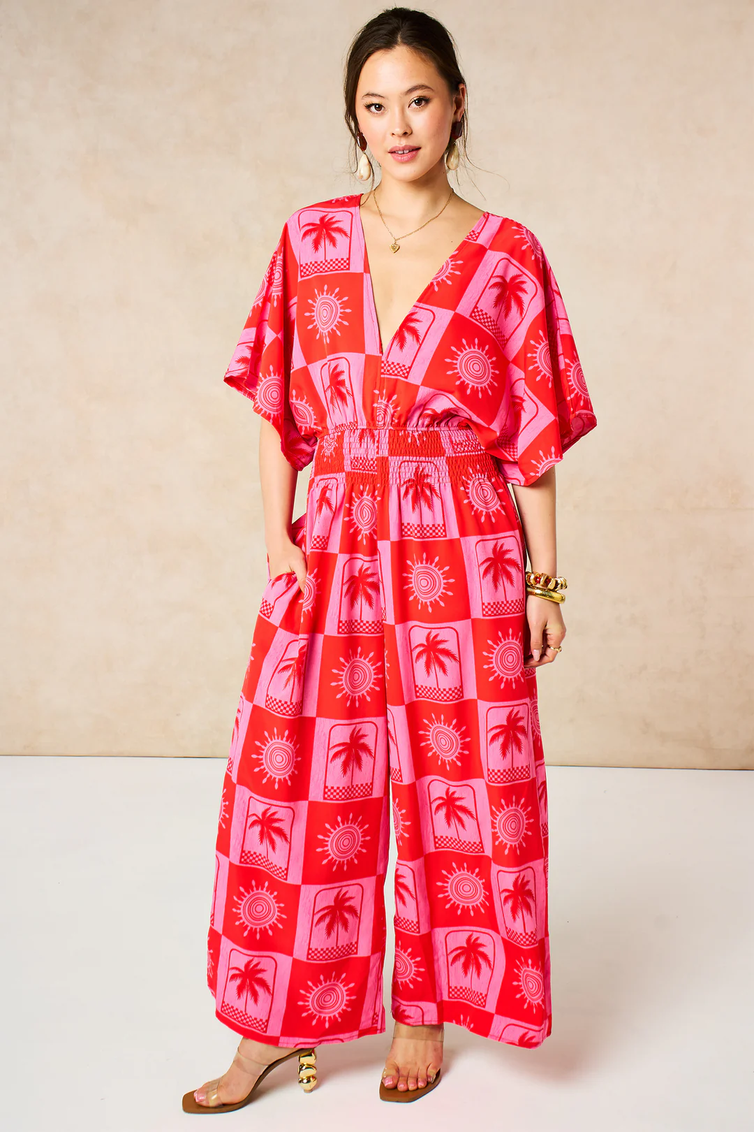 Palma Jumpsuit. Checkboard in pink and red.