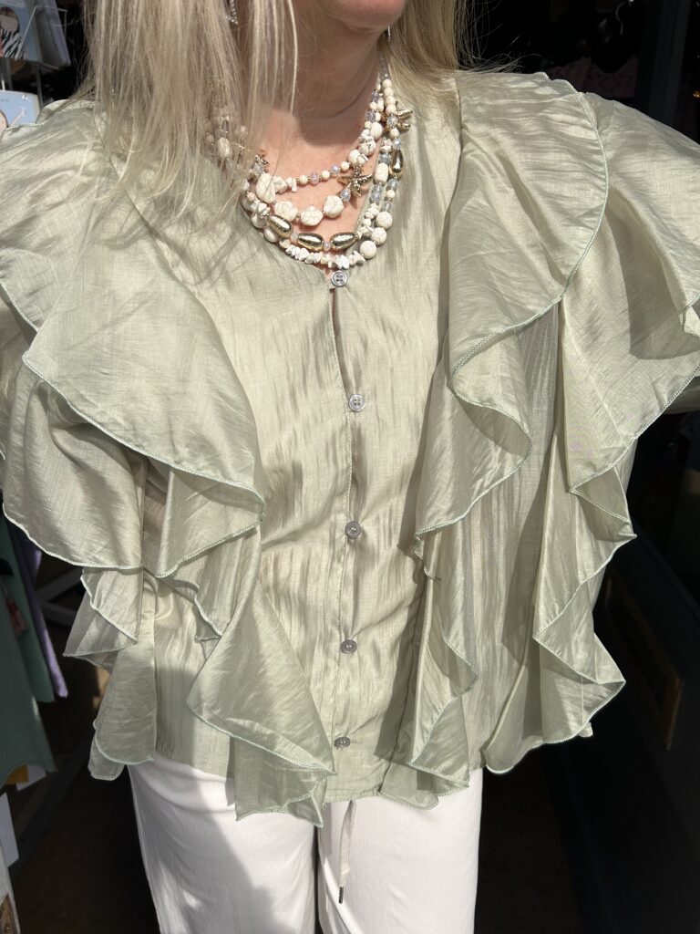 Posie Frill Blouse. Satin like fabric. 3/4 length sleeve. All over front frill.