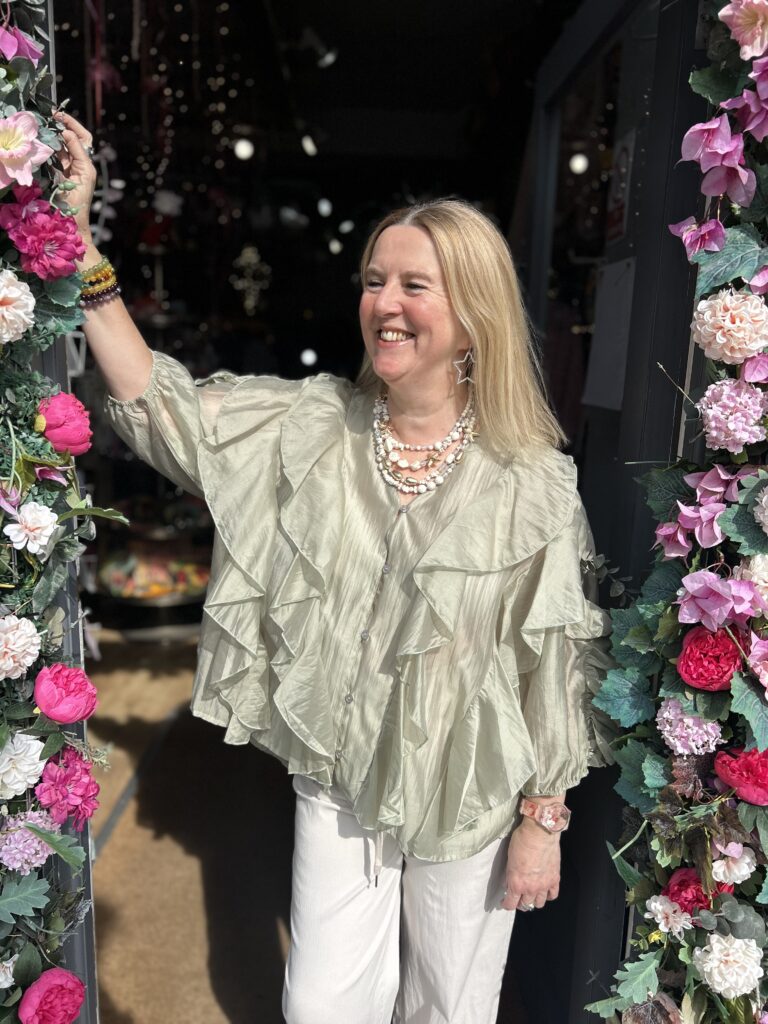 Posie Frill Blouse. Satin like fabric. 3/4 length sleeve. All over front frill.