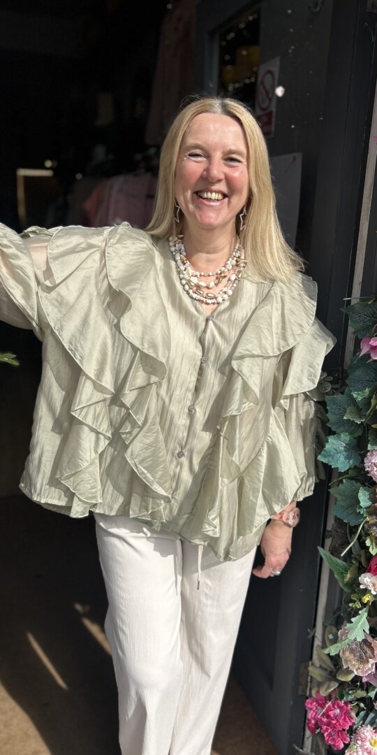 Posie Frill Blouse. Satin like fabric. 3/4 length sleeve. All over front frill.