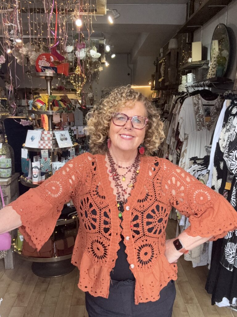 Jasmine crochet cardigan. Flared broderie sleeve and edge detail. Terracota