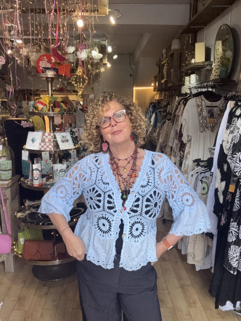 Jasmine crochet cardigan. Flared broderie sleeve and edge detail. Sky