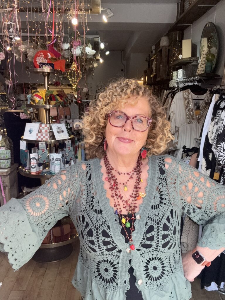 Jasmine crochet cardigan. Flared broderie sleeve and edge detail. Khaki