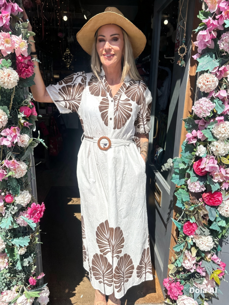 Bluebird dress. Buttoned at the front. Large leaf design. Chocolate