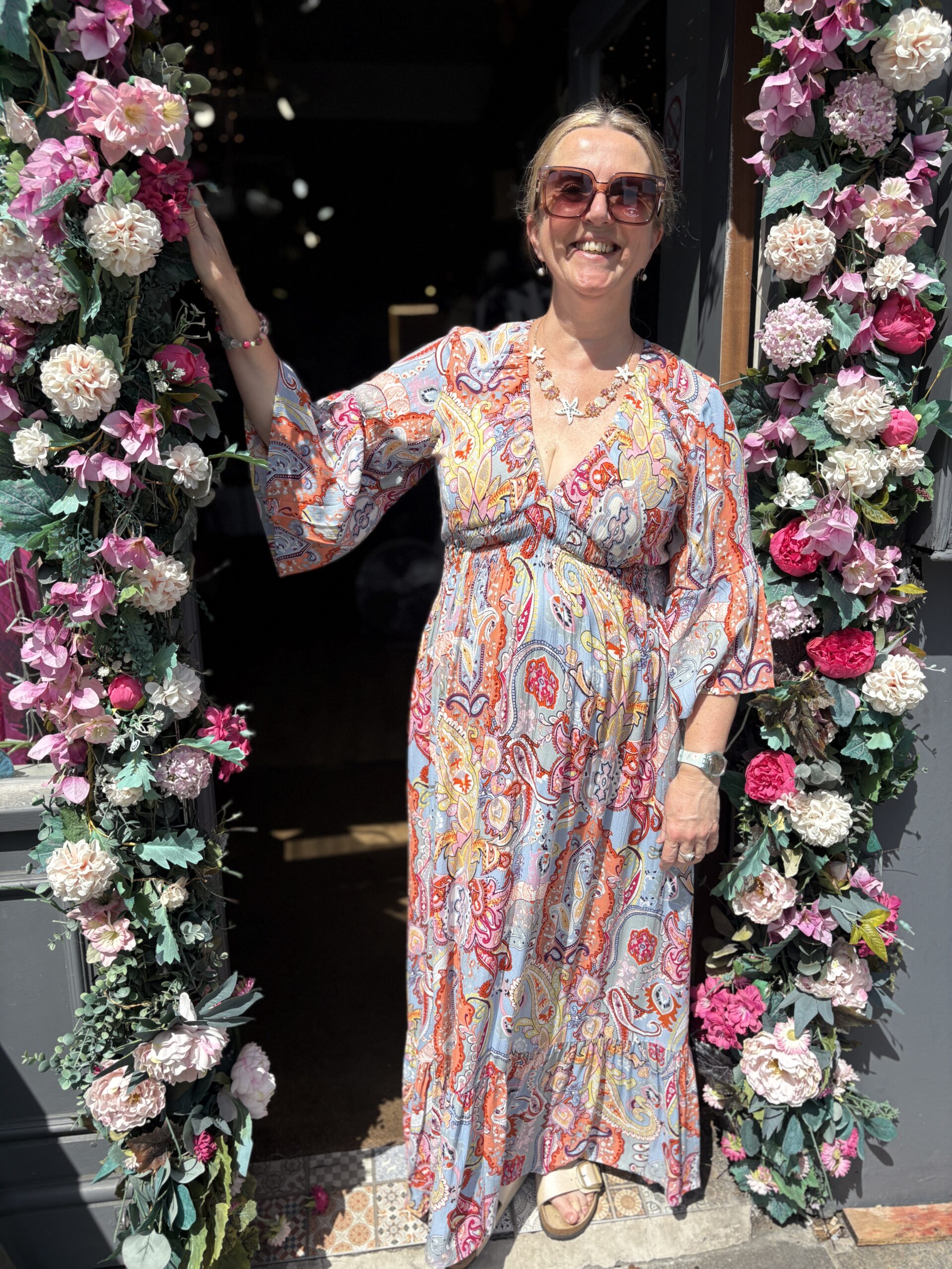 Tammie Maxi dress. Deep v-neck. Puff long sleeves. Large Retro paisley design.