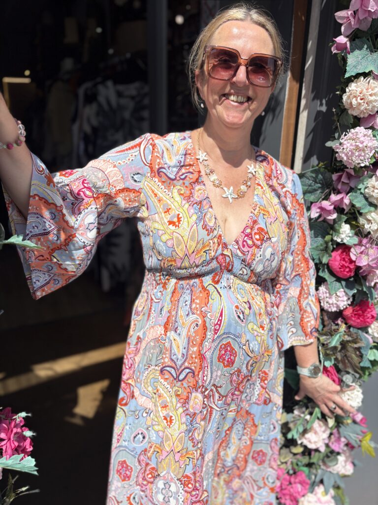 Tammie Maxi dress. Deep v-neck. Puff long sleeves. Large Retro paisley design.