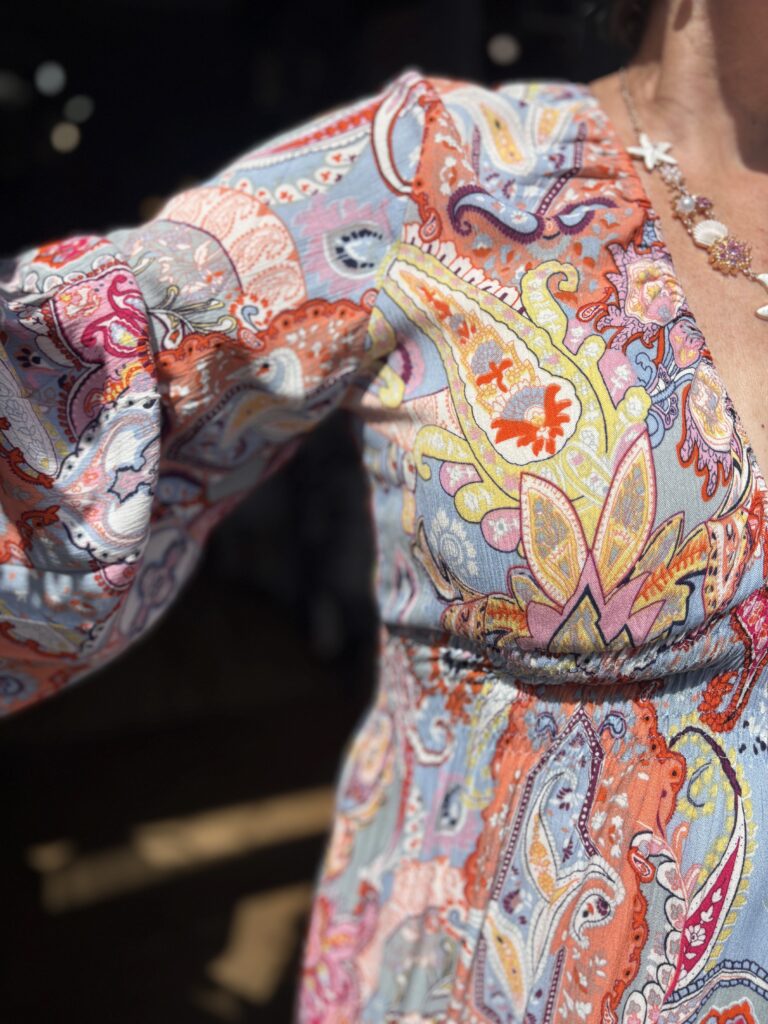 Tammie Maxi dress. Deep v-neck. Puff long sleeves. Large Retro paisley design.