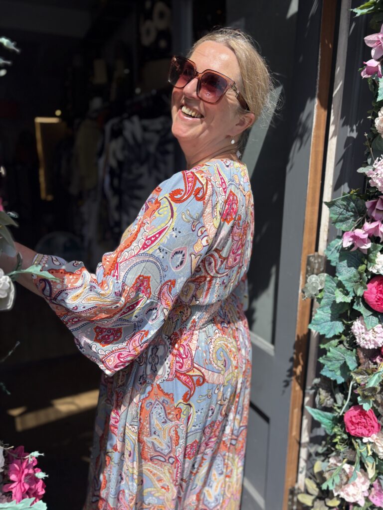 Tammie Maxi dress. Deep v-neck. Puff long sleeves. Large Retro paisley design.