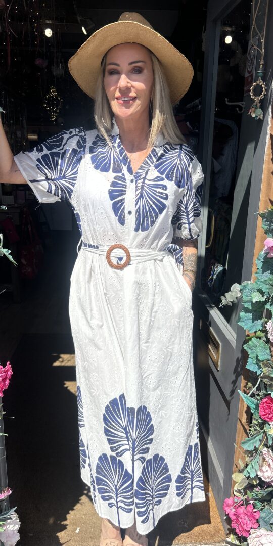Bluebird dress. Buttoned at the front. Large leaf design. Navy.
