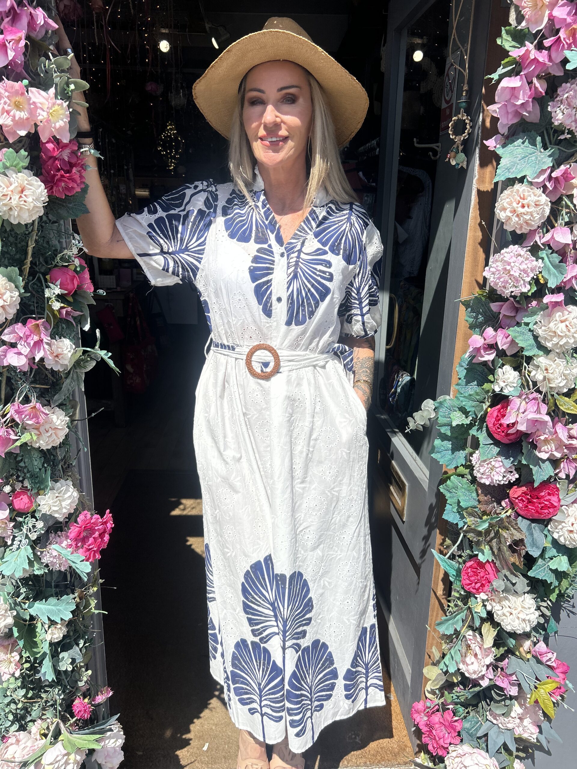 Bluebird dress. Buttoned at the front. Large leaf design. Navy.