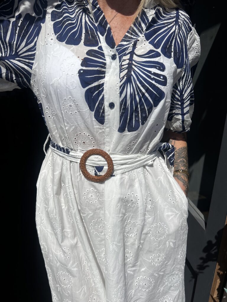 Bluebird dress. Buttoned at the front. Large leaf design. Navy.