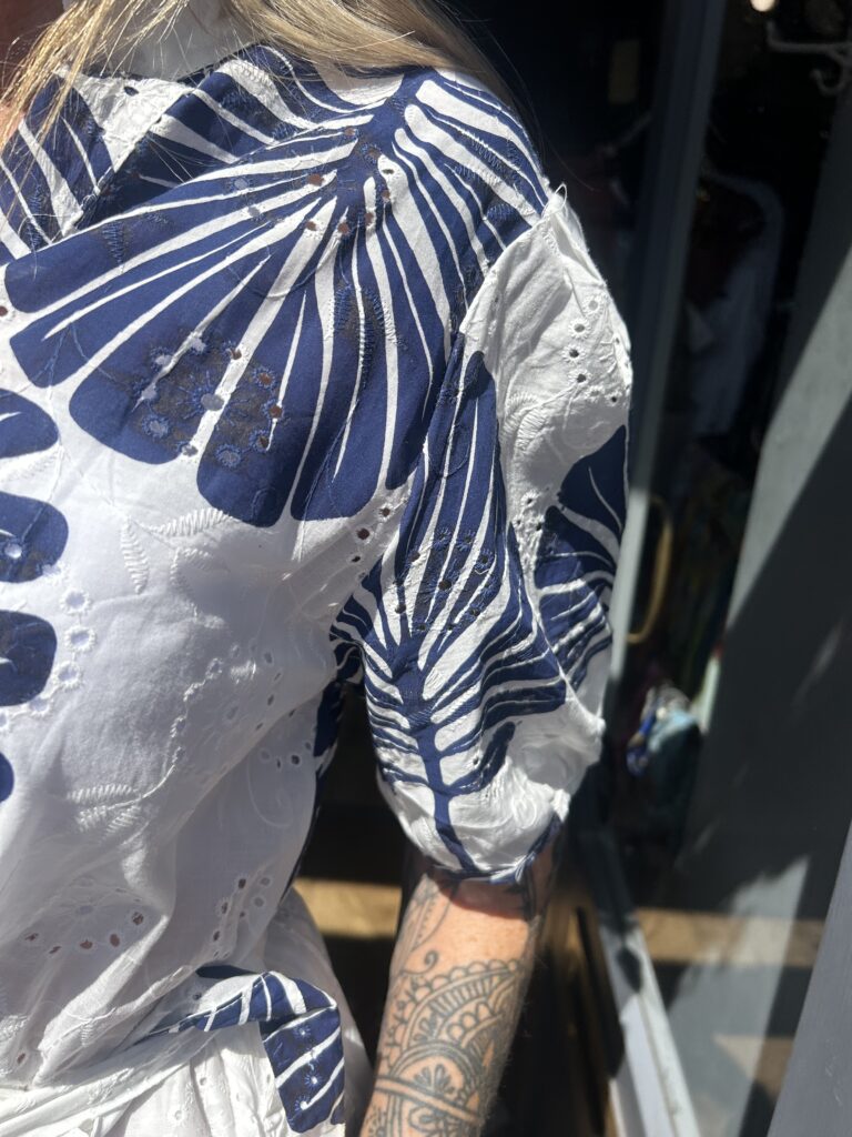 Bluebird dress. Buttoned at the front. Large leaf design. Navy.