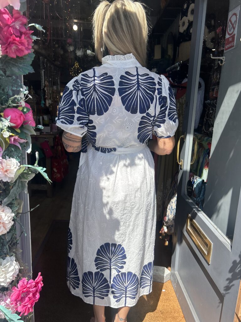 Bluebird dress. Buttoned at the front. Large leaf design. Navy.