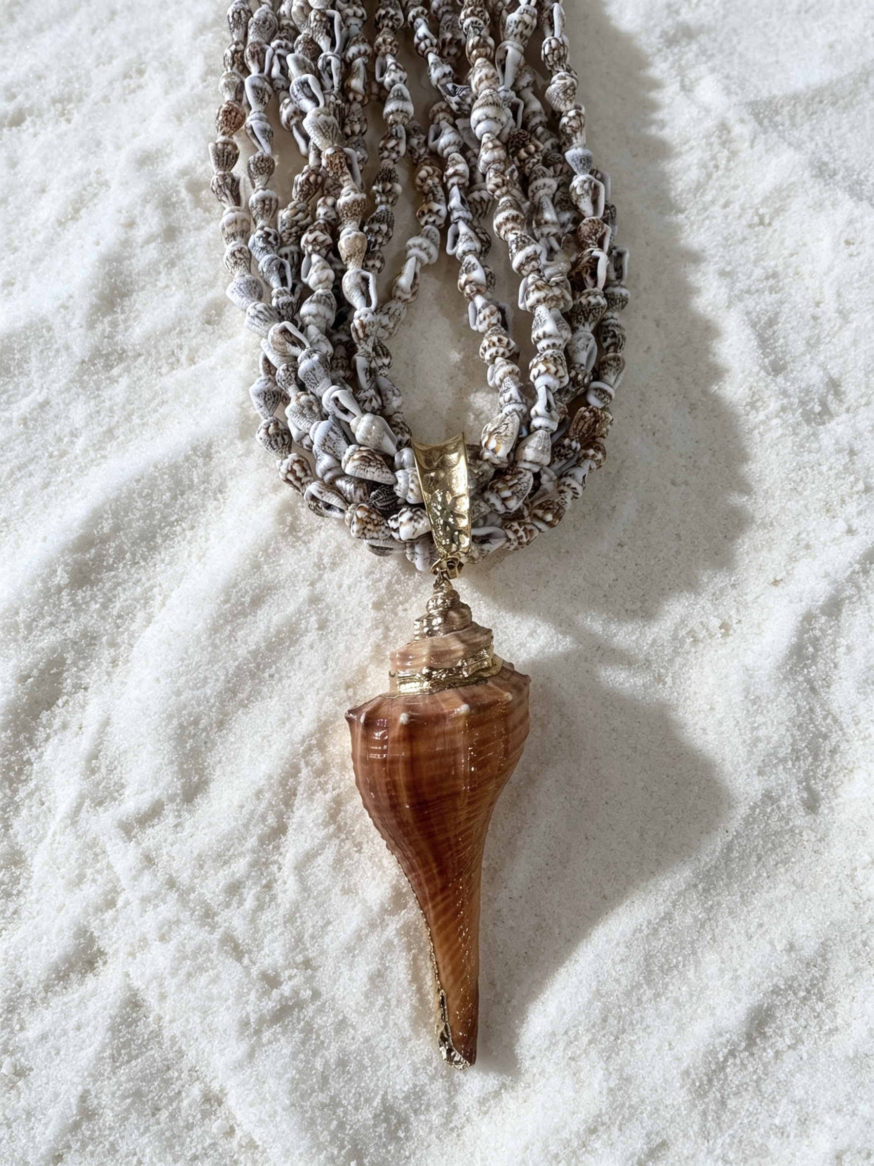 Marisco necklace. Statement big shell and multistrands of tiny shells. Natural