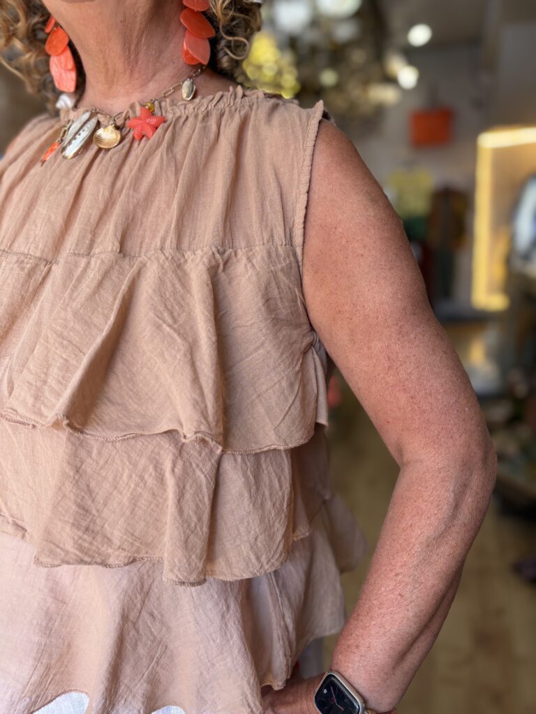 Leo Ruffle top. Sleeveless. 3 large front fills. Caramel