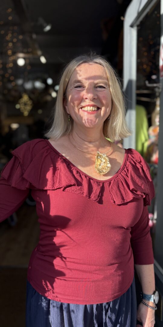 Raven Frill top. Frilly neckline. Wine